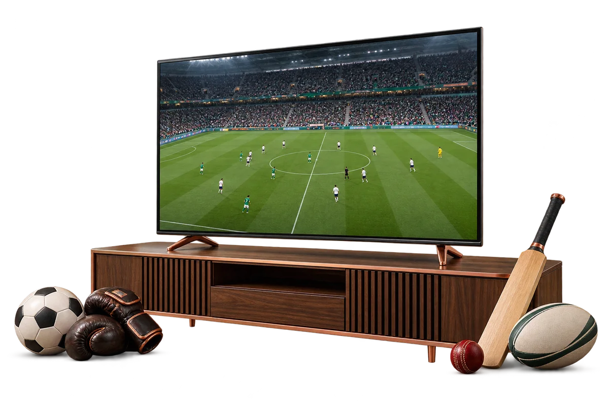 Live football on a television beside football, boxing, cricket and rugby equipment